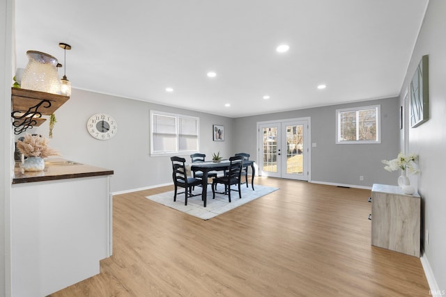 dining area featuring recessed lighting, french doors, baseboards, and light wood-style floors