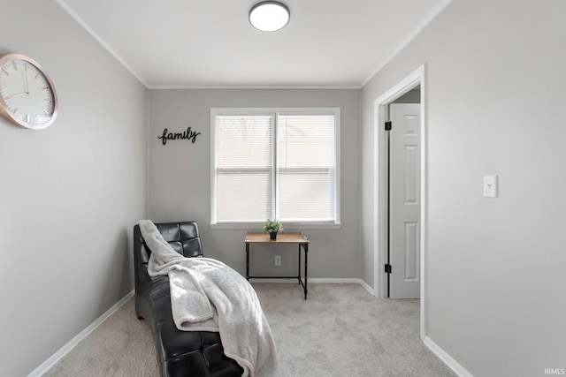 living area featuring crown molding, baseboards, and light carpet