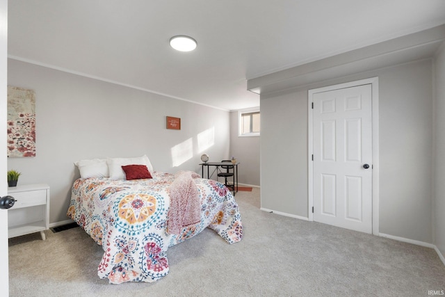 bedroom with baseboards and carpet floors