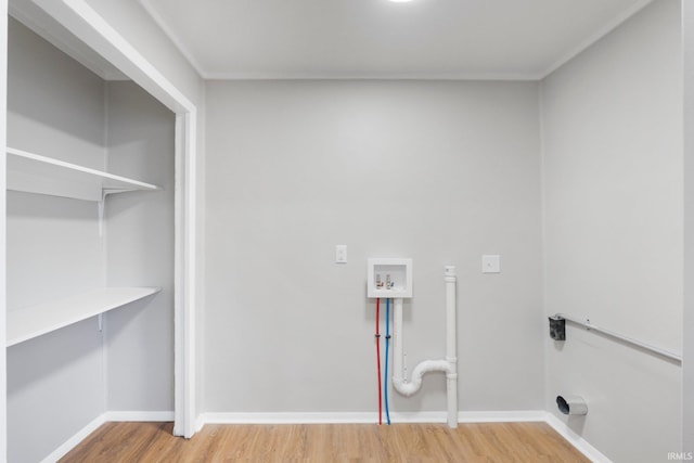 laundry room with baseboards, hookup for a washing machine, laundry area, and light wood finished floors