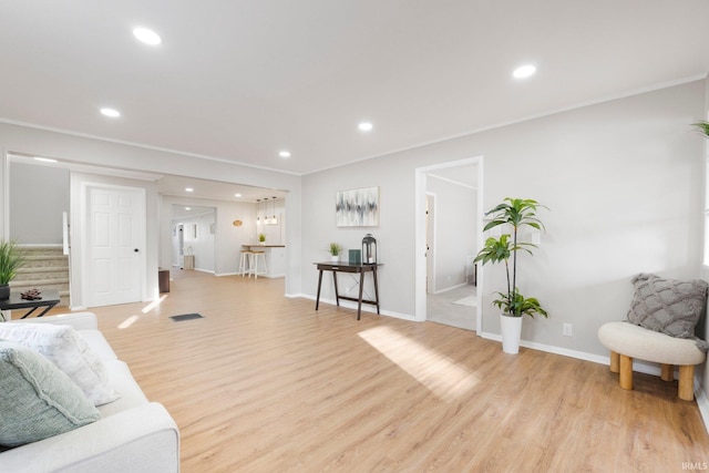 living area featuring stairway, recessed lighting, and light wood-style floors