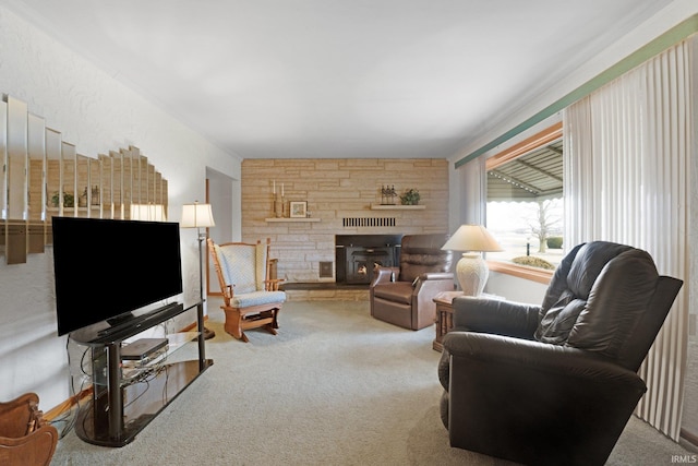 living area featuring a stone fireplace and carpet floors