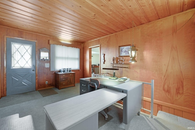 carpeted office space with wooden ceiling and wood walls