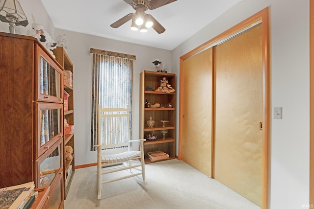 office featuring a ceiling fan and carpet