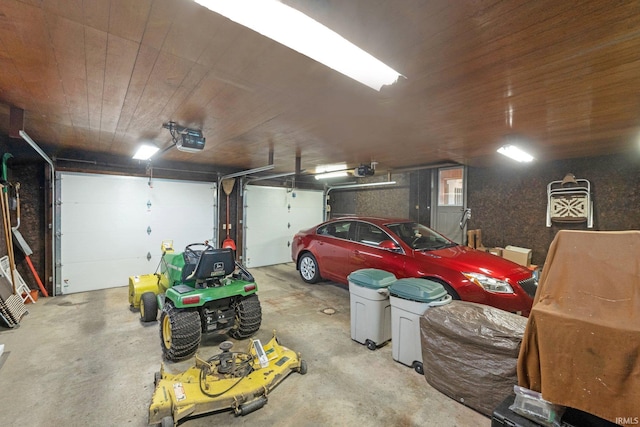 garage with wood ceiling and a garage door opener