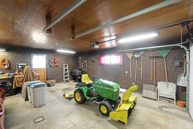 garage featuring wood ceiling and a garage door opener