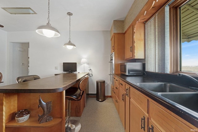 kitchen with dark countertops, a kitchen island, a kitchen bar, stainless steel appliances, and open shelves