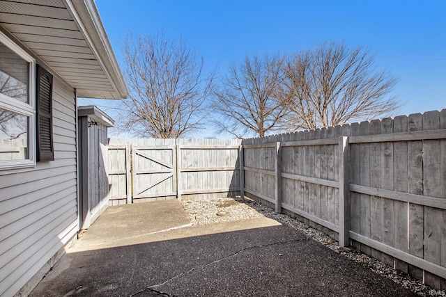 view of yard featuring a gate, a patio area, and fence