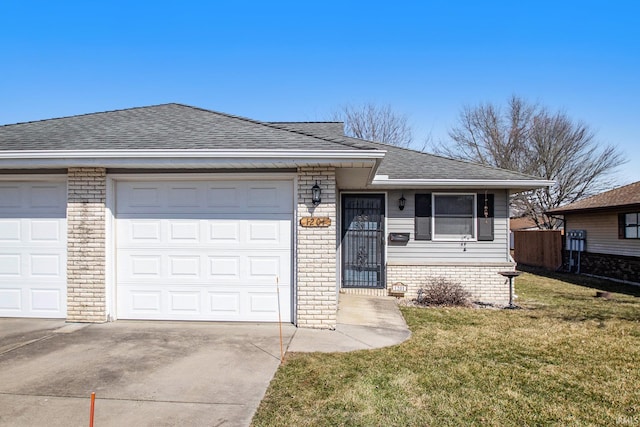 single story home featuring brick siding, a shingled roof, a front lawn, driveway, and an attached garage