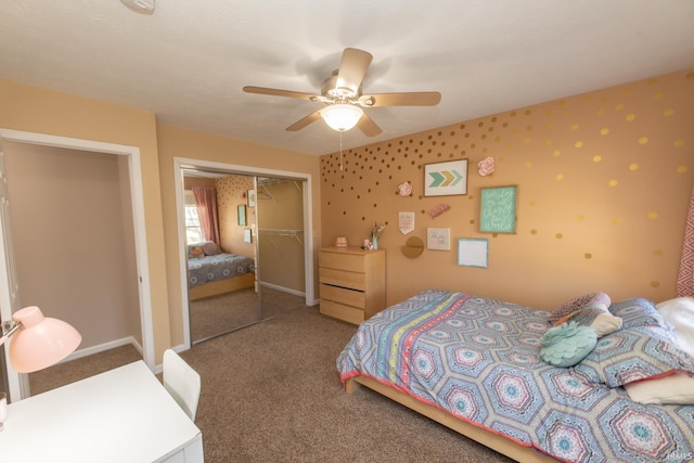 carpeted bedroom featuring wallpapered walls, a ceiling fan, a closet, and baseboards