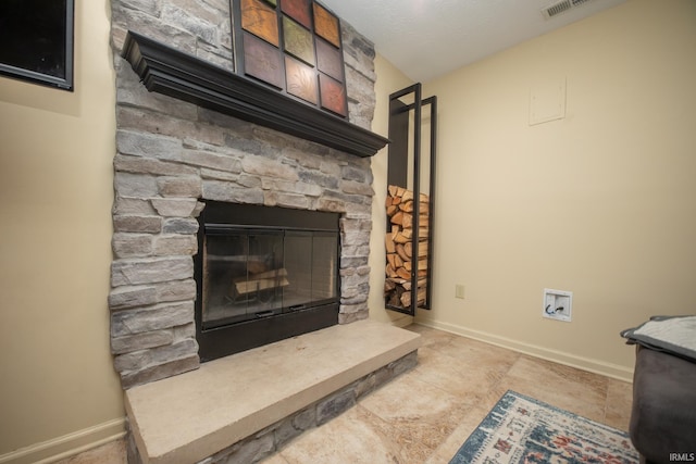 details with visible vents, baseboards, and a fireplace