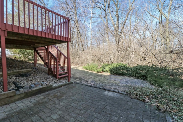 view of patio featuring stairway and a wooden deck