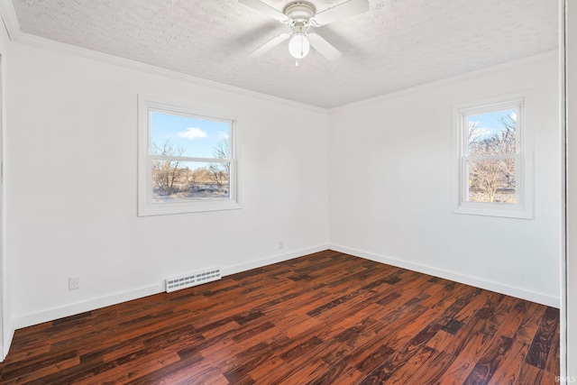 spare room featuring visible vents, plenty of natural light, ceiling fan, and crown molding