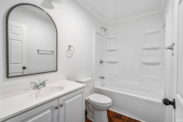 full bathroom with shower / bath combination, toilet, wood finished floors, and vanity