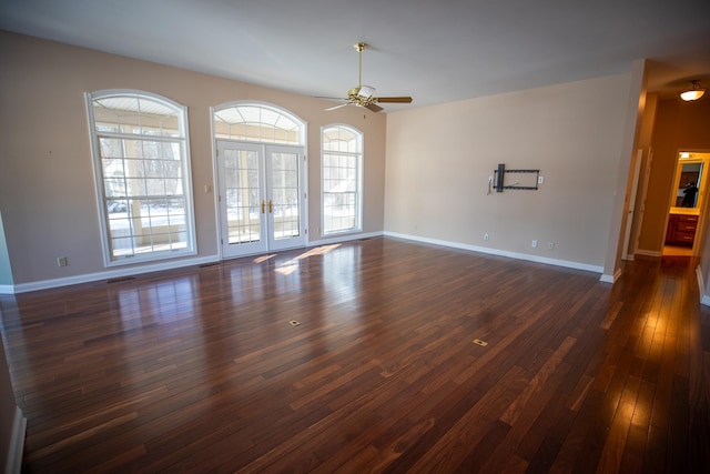 spare room with visible vents, dark wood-type flooring, baseboards, ceiling fan, and french doors