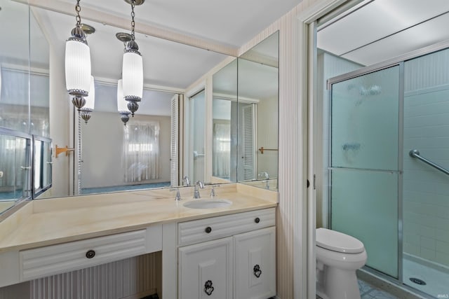 full bath featuring vanity, toilet, and a shower stall