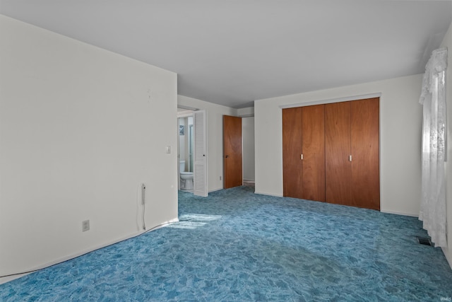 unfurnished bedroom with visible vents and carpet floors