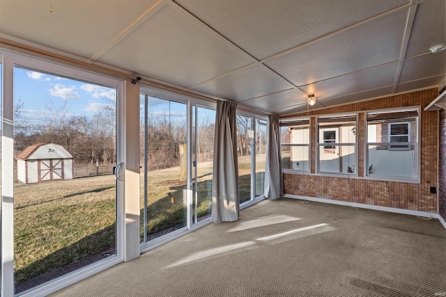 unfurnished sunroom with lofted ceiling