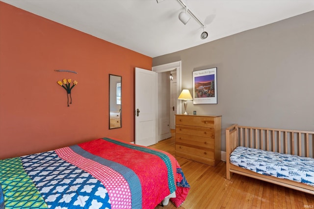 bedroom with light wood-style flooring