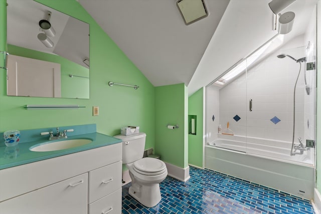 full bath with baseboards, toilet, lofted ceiling, bathing tub / shower combination, and vanity