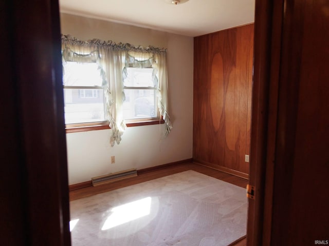 unfurnished room featuring visible vents and baseboards