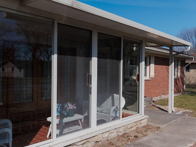 view of patio with a sunroom