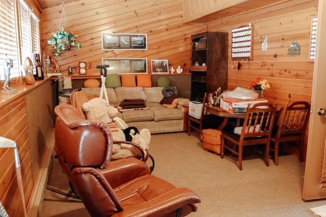 living area with carpet and wood walls