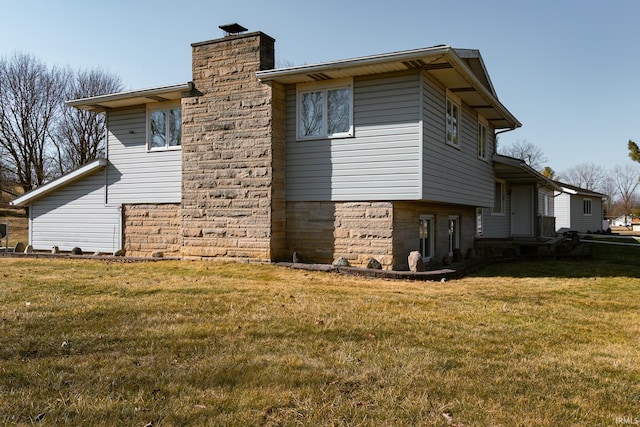 view of property exterior with a yard and a chimney