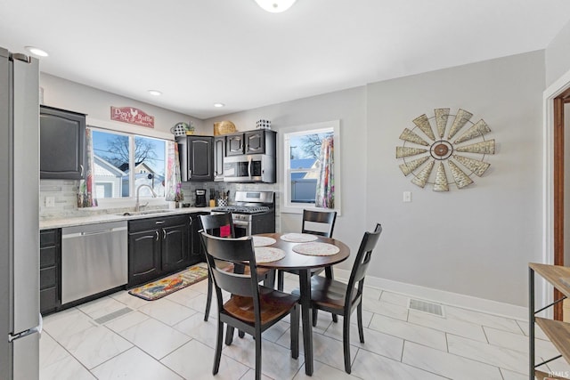 dining room featuring recessed lighting, visible vents, and baseboards