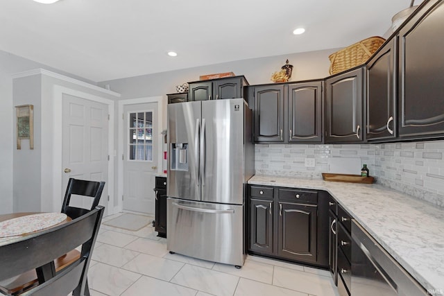 kitchen featuring tasteful backsplash, recessed lighting, and stainless steel fridge with ice dispenser