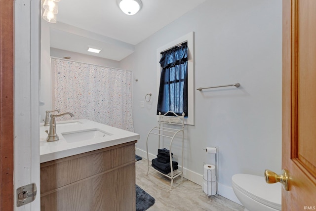 bathroom featuring toilet, a sink, curtained shower, double vanity, and baseboards