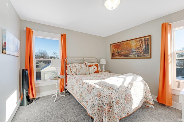 carpeted bedroom with baseboards