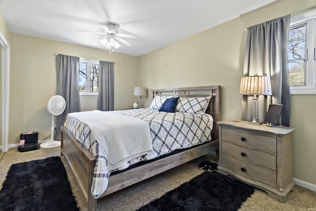 bedroom with carpet flooring, a ceiling fan, and baseboards