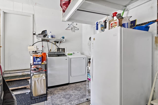 clothes washing area featuring laundry area and washing machine and clothes dryer