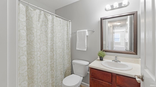 full bathroom featuring visible vents, toilet, and vanity