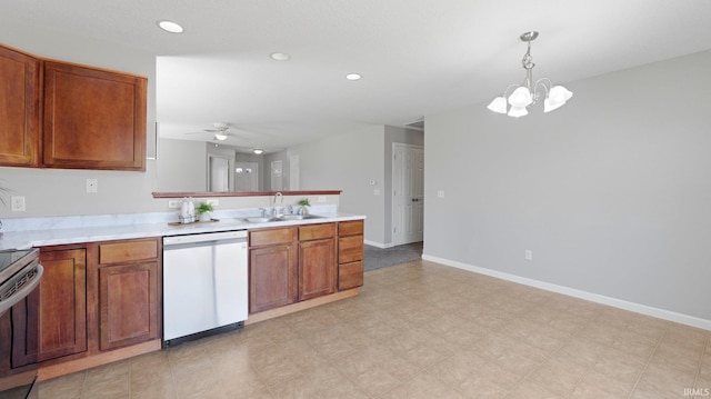 kitchen featuring dishwasher, ceiling fan with notable chandelier, a peninsula, electric range, and a sink