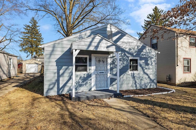 view of front of home featuring an outbuilding