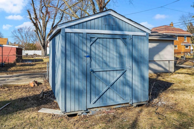 view of shed with fence