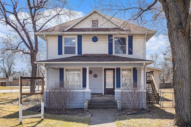 traditional style home featuring a gate, covered porch, and fence