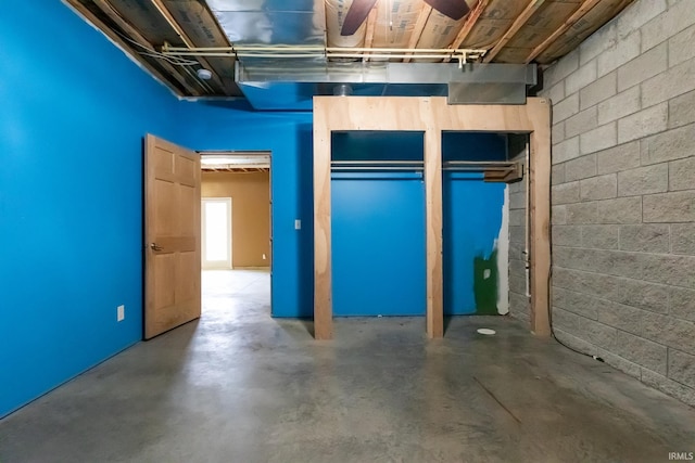 basement featuring concrete block wall