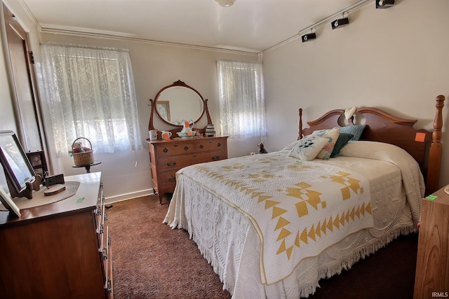 carpeted bedroom with baseboards