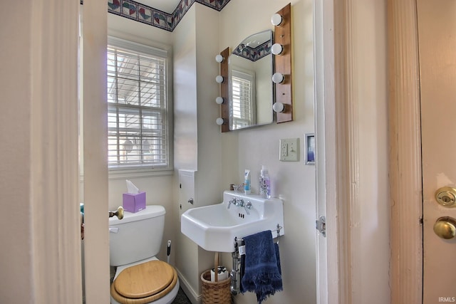 bathroom featuring toilet and a sink