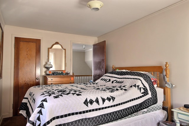 bedroom with crown molding