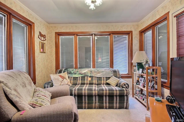 living area with wallpapered walls, crown molding, and carpet