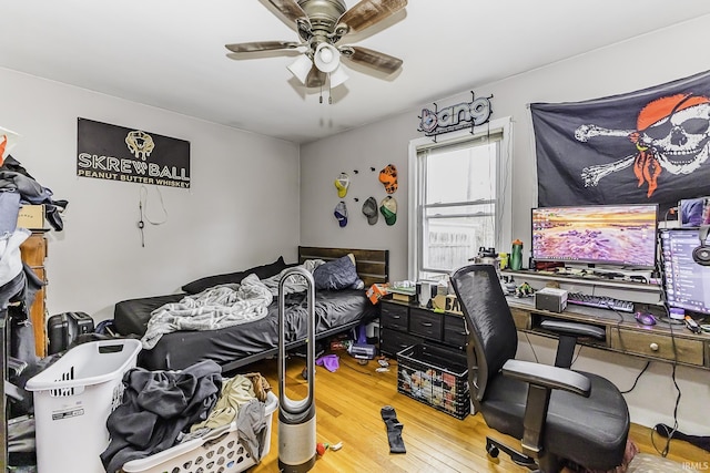 bedroom with a ceiling fan and wood finished floors