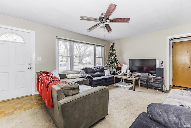 living room featuring a ceiling fan