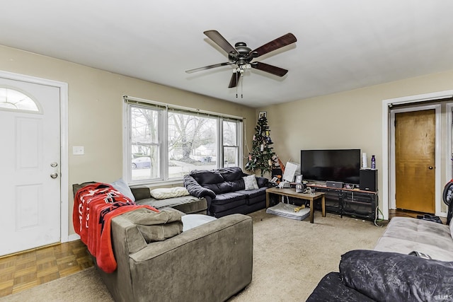 living room featuring a ceiling fan