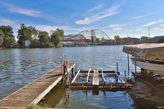 dock area featuring a water view and boat lift