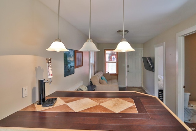 kitchen featuring pendant lighting and vaulted ceiling