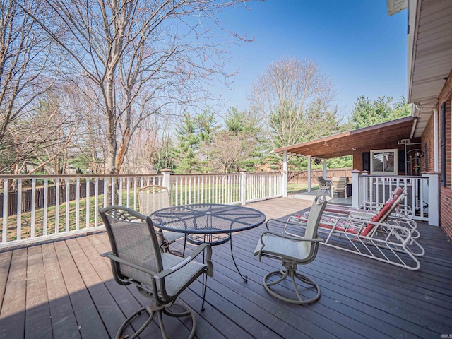 deck featuring outdoor dining area